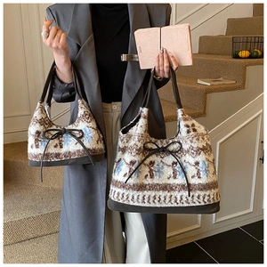 Close-up of Nordic snowflake pattern plush tote bags in two sizes for winter style