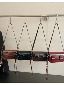 Detailed view of vintage baguette bags in four colors with stylish tassel charms