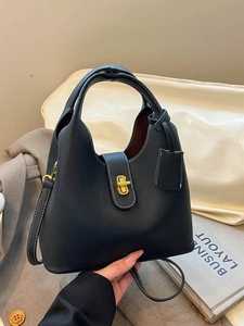 Chic black litchi pattern leather bucket bag with golden buckle and detachable strap