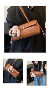 Close-up of brown quilted shoulder bag featuring silver clasp and grey bunny charm