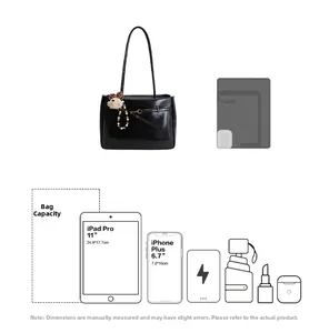 Detail showing high-gloss black tote bag capacity with charms and 11-inch tablet fit