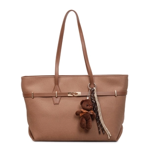 Brown large capacity tote bag with bear charm and tassel on clean white background