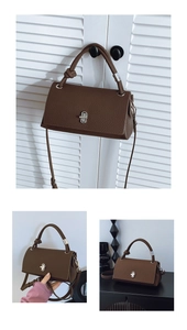Detail of dark brown pebble leather shoulder bag featuring silver metal twist lock buckle
