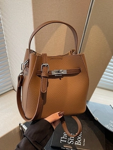 Vintage brown lychee grain leather bucket bag with silver lock and shoulder strap