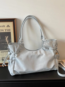 Light gray soft leather tote bag with drawstring detail and large capacity for commuting