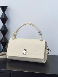 Minimalist cream white square handbag in pebble leather with silver twist lock and knot handle