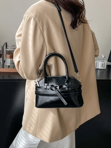 Elegant black glossy leather crossbody square bag with metal buckle strap for women