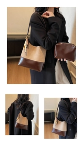 Detail of khakhi and coffee color-block tote bag with wooden bead pendant and clutch