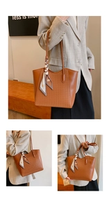 Close-up of brown woven tote bag featuring a decorative silk scarf on the top handle