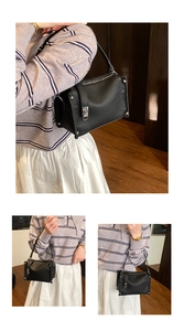 Detailed views of black lychee grain handbag with silver rivets and studs on wooden floor