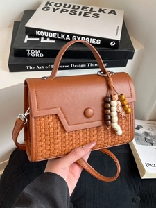 Brown PU leather crossbody bag with woven texture, geometric flap and wood bead charm