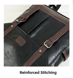 Detailed close-up of reinforced stitching and brown buckle on the black laptop backpack