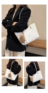 White pebbled leather tote bag with gold lettering and cute dog plush pendant detail