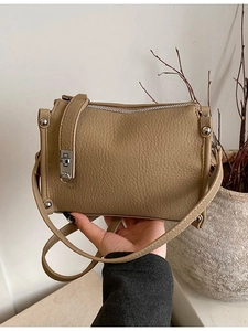 Minimalist khaki litchi leather Boston bag with silver hardware for women