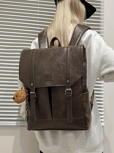 Vintage dark brown faux leather backpack with flap closure and cute bear pendant
