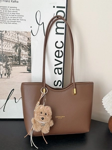 Vintage dark brown pebble grain tote bag with shoulder straps and cute puppy pendant