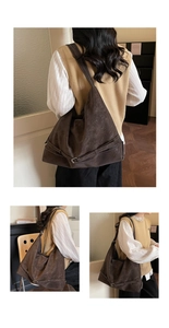 Detailed view of dark brown tote bag featuring contrast stitching and side buckle strap