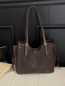 Large dark brown leather tote bag with long straps and side drawstrings for women