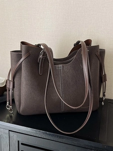 Deep brown large tote bag with white contrast stitching and lychee grain texture