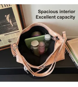 Top view of spacious interior of light pink tote bag with various beauty products