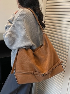 Large caramel suede tote bag with minimalist metal buckle detail for women's daily commute