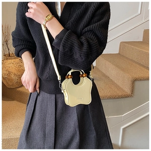 Chic cream mini crossbody bag with unique star shape and vintage wooden bead handle