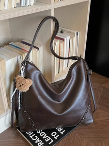 Retro brown large capacity hobo bag with stud details and cute plush bear charm
