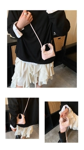 Detailed views of pink lace mini crossbody bag with top handle and BELARE logo
