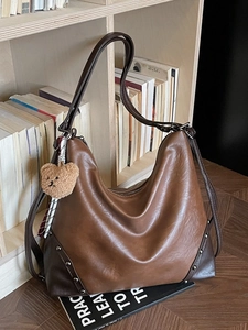 Vintage brown leather large capacity crossbody bag with teddy bear pendant and rivets