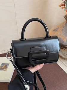 Elegant black glossy small square handbag with top handle and adjustable shoulder strap