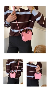 Pink star-shaped crossbody bag featuring a wooden bead handle and ReBorn embossed logo