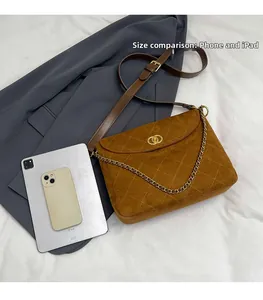 Brown quilted tote bag shown with iPhone and iPad to demonstrate the actual product size
