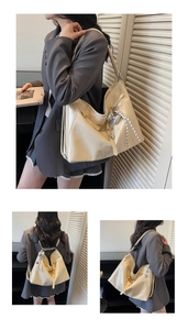 Detail of glossy beige tote bag with heart charm used as a shoulder and backpack