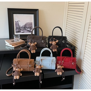 Chic suede crossbody bags in five colors with cute bear charms and metal clasps