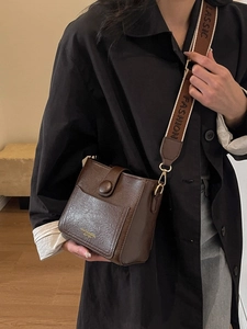 Retro dark brown crossbody bucket bag with wide strap and fashion leather texture