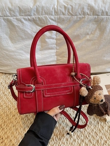 Fashion red leather handbag with white stitching and bear charm for women