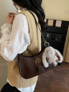 Retro dark brown leather underarm bag with metal buckle and plush bunny charm detail