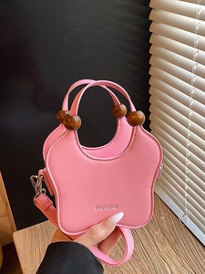 Pink butterfly shaped handbag with wooden bead handles and detachable shoulder strap