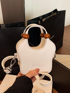White butterfly-shaped PU leather handbag with brown wooden beads and silver crossbody strap