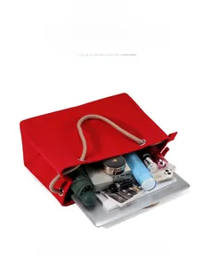 Detailed interior view of a red canvas tote bag showing large capacity storage space