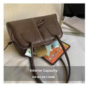 Deep brown leather handbag showing large capacity for tablet and daily items