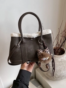 Retro brown tote bag with fuzzy white trim and cute monster charm for women