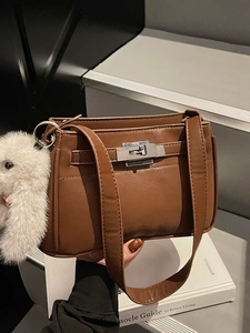 Brown leather Kelly style shoulder bag with silver lock and plush rabbit pendant