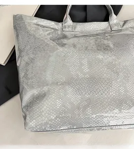 Detail view of snakeskin pattern on translucent large capacity waterproof tote bag
