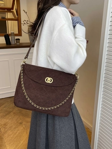 Vintage brown suede messenger bag with quilted stitching and gold chain strap
