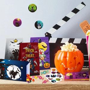 Halloween party gift bags with assorted spooky illustrations and matching stickers