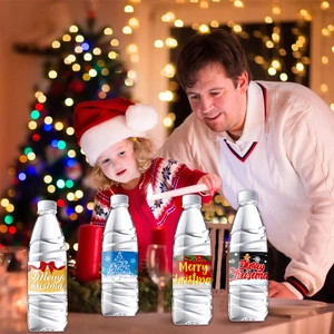 Set of four Christmas themed water bottles with festive Merry Christmas labels for party decor