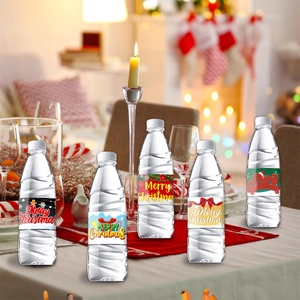 Close-up of festive Christmas bottle labels with snowman and gingerbread man designs