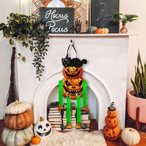Halloween pumpkin wall decor with black cat on mantel with festive background