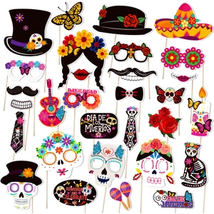 Day of the Dead photo booth props kit with colorful skull masks and Mexican party decor